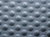 Extreme close up of gray dimple texture surface background from rubber grip or shoe sole with copy space