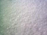 Extreme blurry close up on styrofoam or fuzzy object as abstract background with copy space