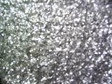 Full frame festive background of sparkling silver glitter to celebrate a holiday or special occasion or for use in craft work