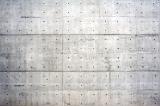 Large background wall of reinforced concrete with copy space holes for rods showing
