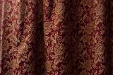 Close up on floral pattern in folds of curtain as elegant abstract background with copy space