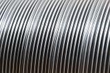 Full frame close up on new galvanized steel ribbing for pipes or curved metallic lines