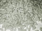 Abstract background composed of foam peanuts as viewed from overhead on white