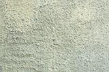 Full frame top down stucco or rough wall background in weathered white paint with copy space
