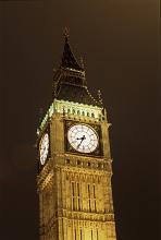 Illuminated Big Ben or Elizabeth Tower, landmark and tourist attraction from London, Uk, with the clock showing the hour, at night