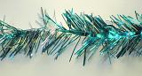 Garland of glittering blue metallic tinsel for a festive decoration for Christmas or New Year, close up detail