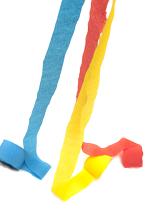 Rolls of Colorful Crepe Paper Streamers Unravelling on White Background