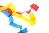 Three vibrant colourful paper streamers in red, yellow and blue for a party, carnival or festive occasion on a white background