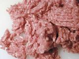 Background texture of raw minced meat waiting to be cooked on white