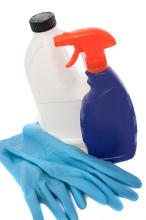 bahtroom cleaning products, spray and rubber gloves