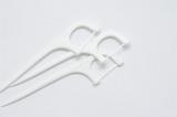 three dental tooth floss picks on a white background