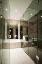 glass interior of a stylish modern hotel bathroom