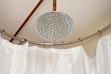 a large watering can style metal shower head