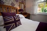 Union Jack pillow on a bed in a patriotic British bed and breakfast accommodation