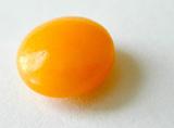 Close up image of a round vitimin C orange supplement