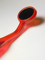 Close Up Detail of Red Plastic Dental Mirror Used by Dentist for Examining Teeth
