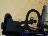 a riders eye view of a bike ride along a dirt trail