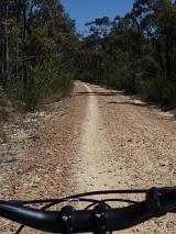 riders point of view - mountain bike ride along a dirt track