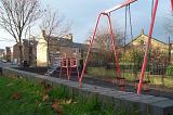 swings and a climbing frame, an urban playground