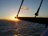 a relaxing way to travel, sailing on a yacht at sunset