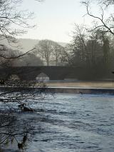 a cold winter scene, frost and morning mists, lakeside, uk