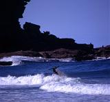 a surfer in the water of the coast of australia