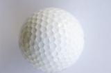 a golf ball on a white background