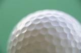 close up on the dimples on a golf ball
