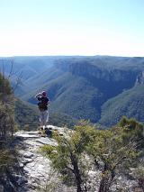 a walker enjoying the view on a wilderness mountain treck