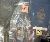 Antistatic plastic bags with warning labels to protect electronic equipment such as computer hard drives in a full frame background