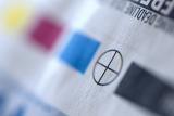Extreme close up of offset press registration marks with alignment, black, cyan, magenta and yellow plate colors