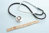 knowledge and conversions in website analysis concept with doctor stethoscope and square piece letters spelling the word conversions