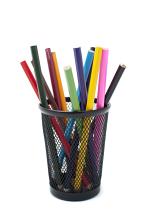 Colored pencils in black pen holder on white background