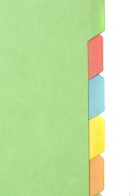 Blank coloured index tabs in a folder filing system