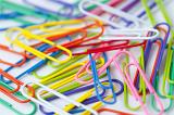 Pile of colorful paperclips background- shallow DOF