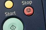 Close up view of the start, stop, and cancel buttons printer control panel