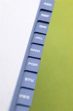 Alphabetic indexed address book with the cover open to reveal the letter tabs