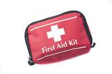 Portable first aid kit in a red bag with a white cross used in medical emergencies for the treatment of patients in situ