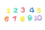 Colourful set of plastic numbers, one through ten, on a white background for use in a preschool or kindergarten to teach kids the basics of mathematics