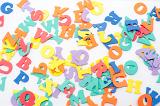 Scattered multi colored letters of the alphabet, learning concept